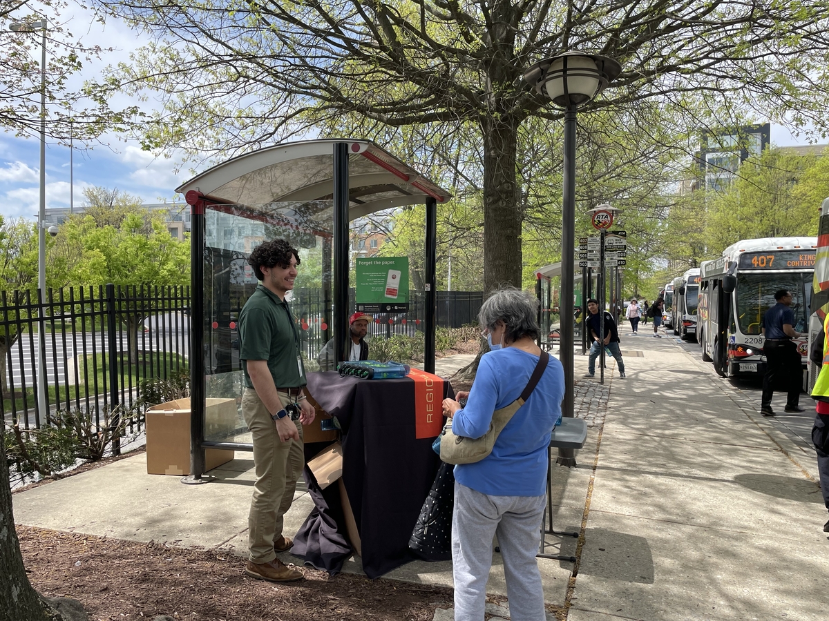 Thanking a customer at Earth Day pop up