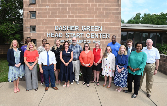A photo of County Executive Calvin Ball and representatives from the Community Action Council and other outside Dasher Green Head Start Center. 