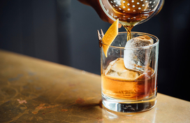 Liquor being poured into a small glass