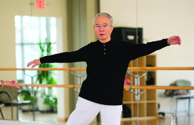 older man exercising in a studio
