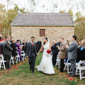 A newly wed couple walking down the aisle after their ceremony at Waverly Mansion. 